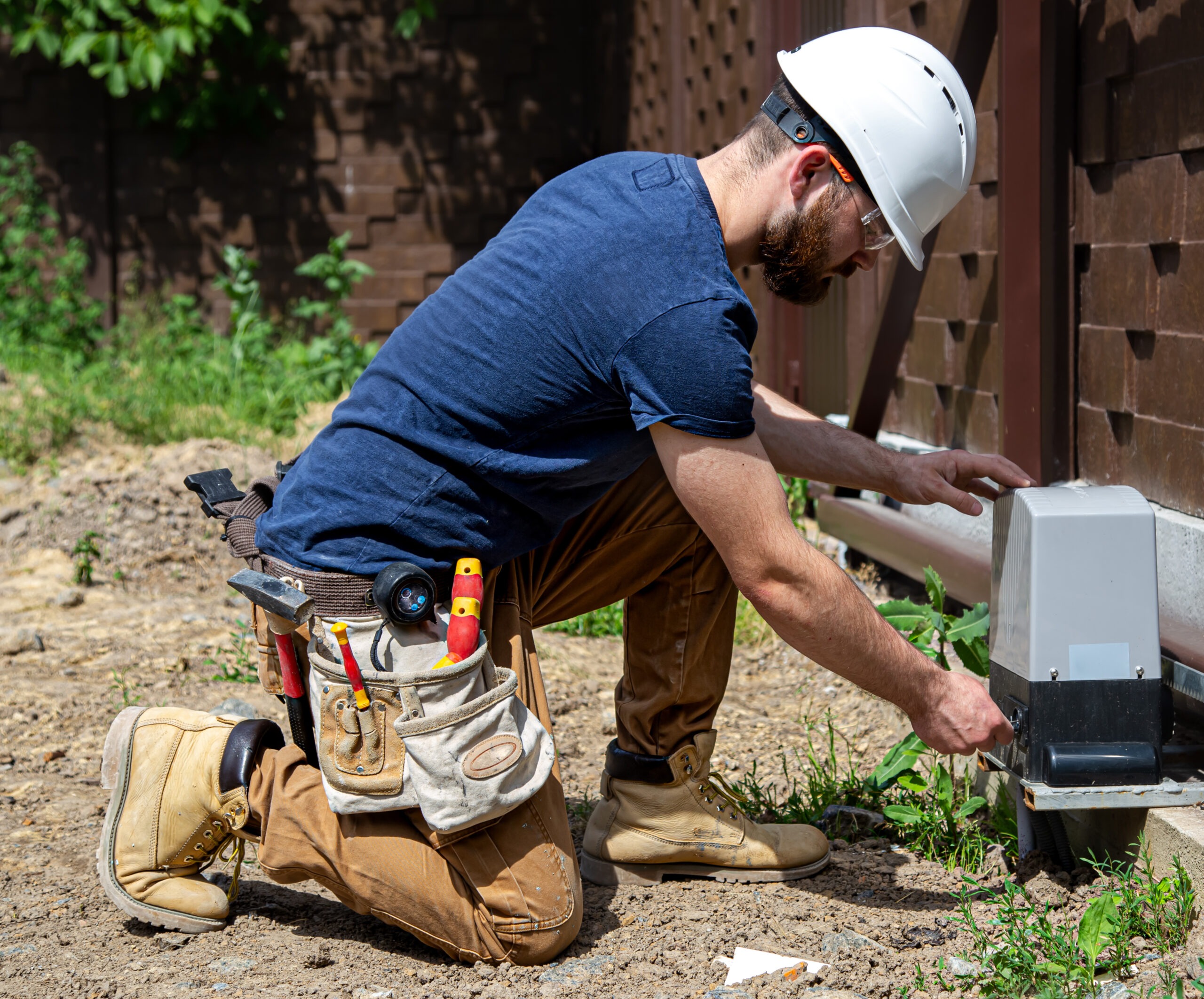 Technician Installing or Adjusting Septic Piping in a Residential Yard